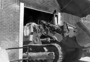 A bulldozer coming out from under the Stevens Center during repair. Courtesy of Scott Spencer.