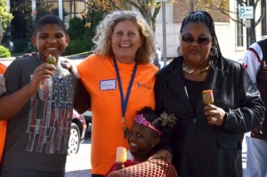 Outreach and Hospitality coordinator of First Presbyterian Church, Karen Schoulda (orange shirt) with Crystal Hall and her two grandchildren, Rahnard and Mila Hall