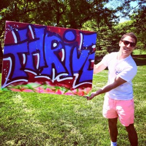 Event organizer, Alex Patrone, displaying his graffiti advertisement for the event