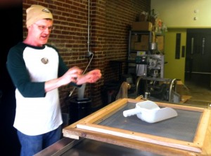 Brent Peters, artisan chocolate maker at Black Mountain Chocolate Company, explains the process of cleaning cacao beans. 