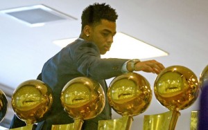 Lakers rookie D'Angelo admires several of the Lakers' sixteen championship trophies. Lakers fans are hoping he will usher in a new era of Purple and Gold dominance as the franchise transitions to life post-Kobe.